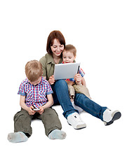 Image showing mother with two sons and Tablet Computer