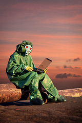 Image showing Man in protective suit works in contamination area