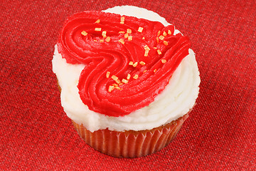 Image showing Valentine's day cupcake over red background