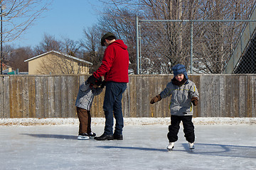 Image showing Family at a skating rink