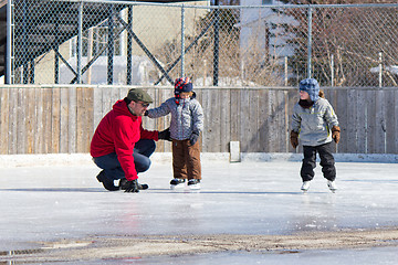 Image showing Family having fun at the skating rink