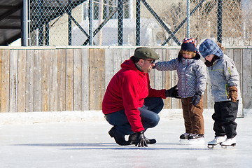 Image showing Family having fun at the skating rink