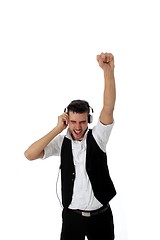 Image showing Exuberant young man listening to music