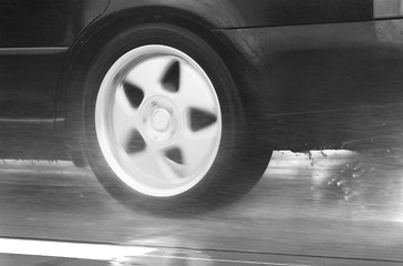 Image showing sport car driving fast in a rainy day