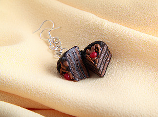 Image showing Fashion earrings with chocolate cake