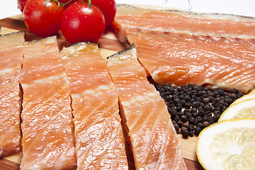 Image showing close-up of smoked salmon  with tomato and pepper