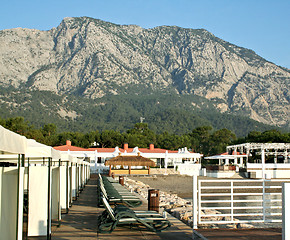 Image showing Sky, ocean, mountain, beach, and buildings