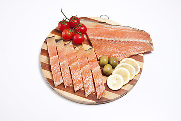 Image showing fresh red fish fillet on wooden plate