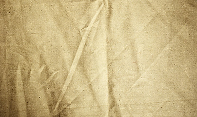 Image showing Background of crumpled dense fabric colored in beige tones