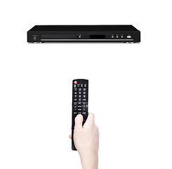 Image showing Remote control in the hand against dvd