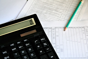 Image showing Calculator and pencil on white background