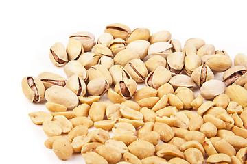 Image showing Fresh salty peanuts with pistachio isolated