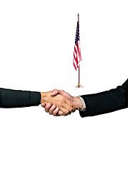 Image showing hand shake and a American flag