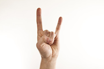 Image showing A man's hand giving the Rock and Roll sign.