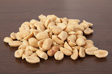 Image showing Pile of Peanuts on wooden