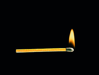 Image showing Burning match on a black background