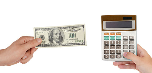 Image showing Calculator and hand with 100 dollars