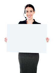 Image showing Call centre executive standing with a blank billboard