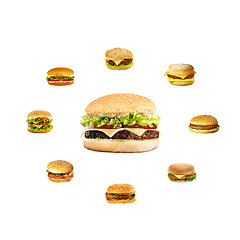 Image showing nice big cheeseburger in the center hamburgers