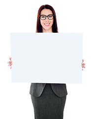 Image showing Businesswoman holding a blank poster