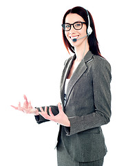 Image showing Smiling telemarketing girl posing in headsets