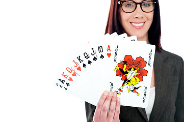 Image showing Charming businesswoman holding playing cards