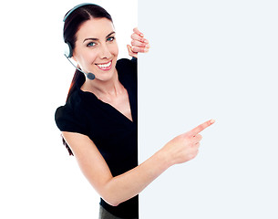 Image showing Customer service woman with blank billboard sign banner