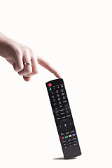 Image showing Remote control and hand