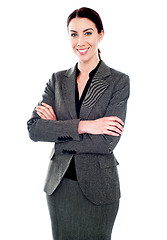 Image showing Corporate lady standing with her arms crossed
