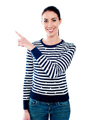 Image showing Woman pointing index finger at something