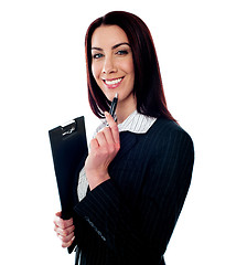Image showing Female executive holding a clipboard