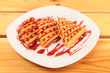 Image showing Waffles with strawberry on wooden table