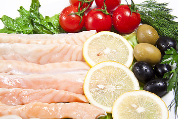 Image showing raw red fish with lemon and olive