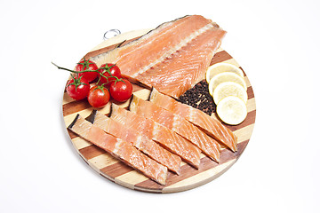 Image showing fresh salmon on a cutting board isolated