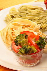Image showing two italian tagliatelles and tomato with broccoli condiment