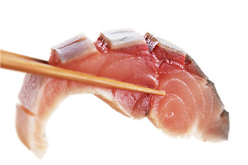 Image showing A piece of fish meat in chopsticks