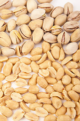 Image showing Fresh salty peanuts with pistachio