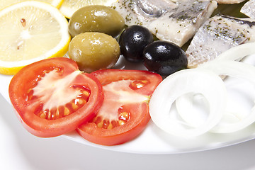 Image showing slices fish and tomato slice with onion