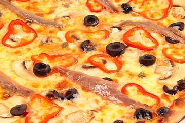 Image showing Pizza with olives and fish background