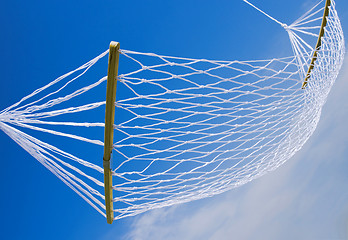 Image showing view of nice white hammock on blue sky