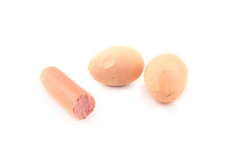 Image showing Sausage and cracked eggs