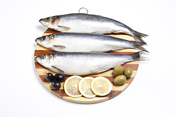 Image showing Fish with lemon and olive on plate