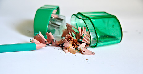 Image showing Sharpened pencil next to the sharpener and shavings.