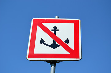 Image showing Warning sign prohibit ship moor riverside blue sky 