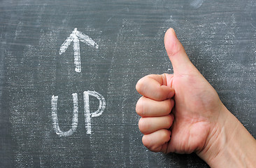 Image showing Up - word written on a blackboard with an arrow and thumb up gesture