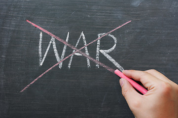 Image showing War - word crossed out with red chalk 