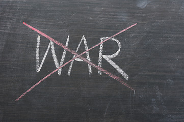 Image showing War - word crossed out with red chalk 