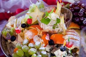 Image showing festive dish with fruit, cheese and sauce