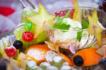 Image showing festive dish with fruit, cheese and sauce