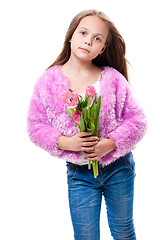 Image showing beautiful  little girl with bouquet of pink tulips isolated on white